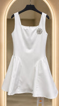 Curved short dress with stones broche